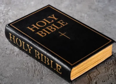 depositphotos_350939946-stock-photo-holy-bible-grey-textured-surface